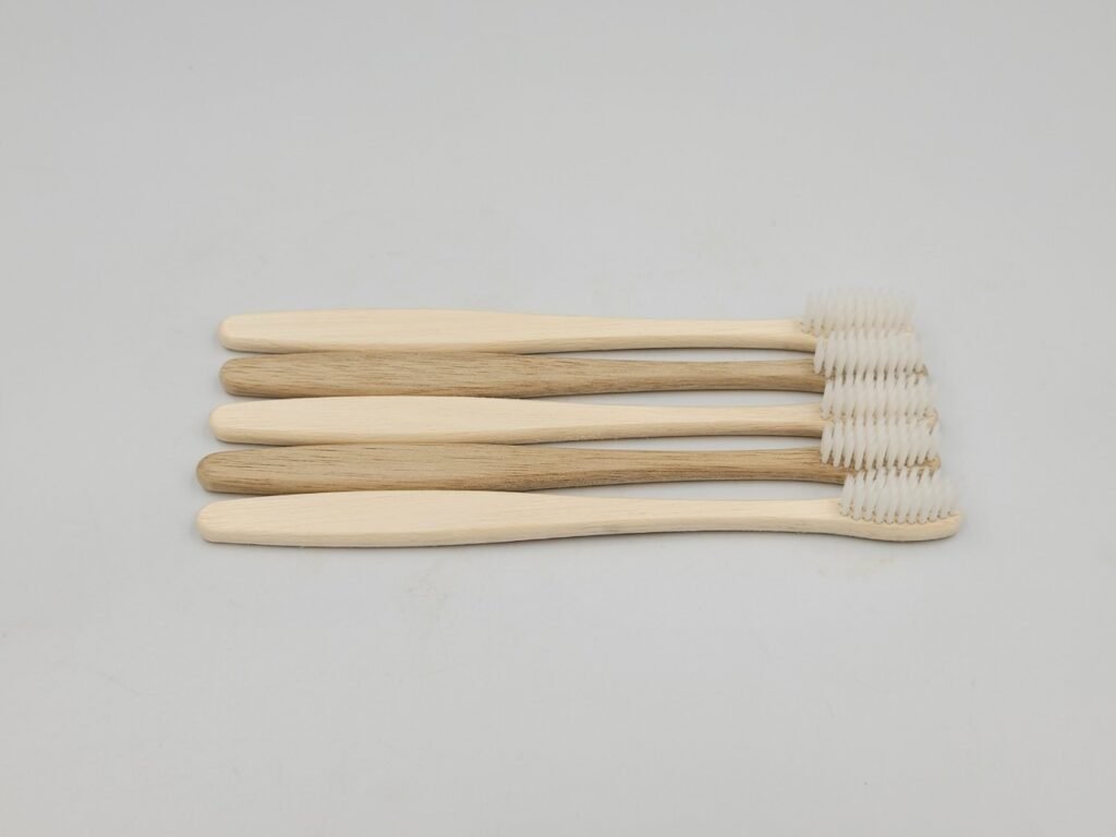 Wooden brush with white bristles